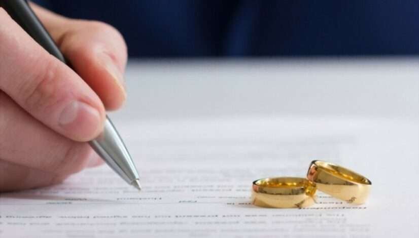 divorce papers and rings